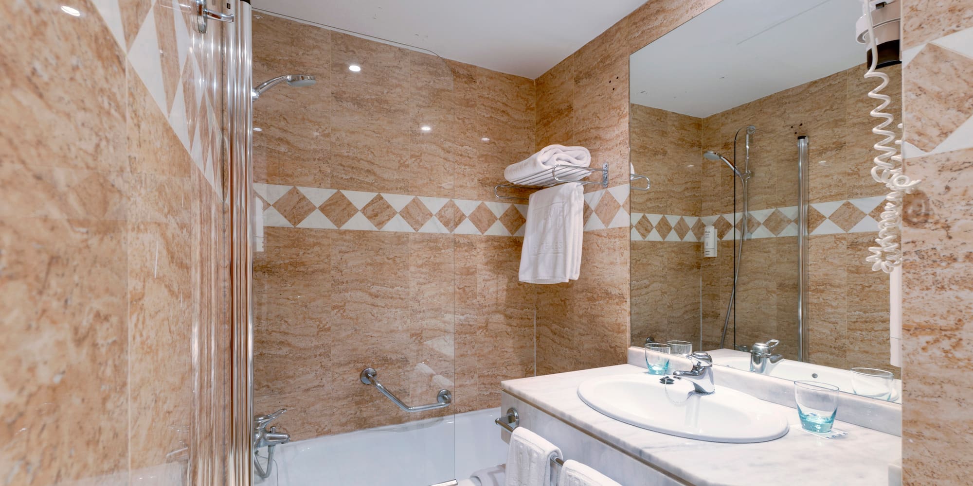 a bathroom with a shower and sink