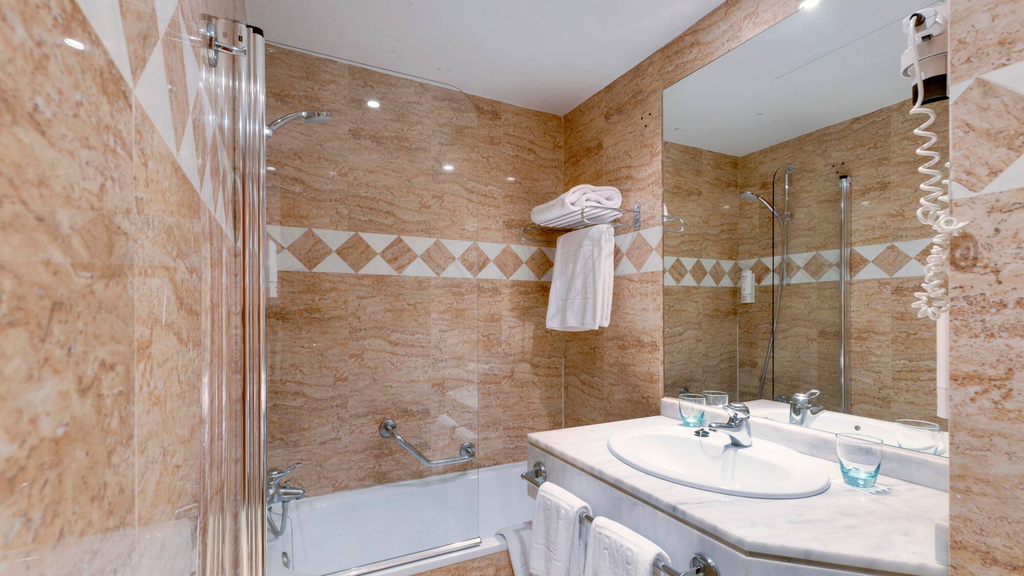 a bathroom with a shower and sink