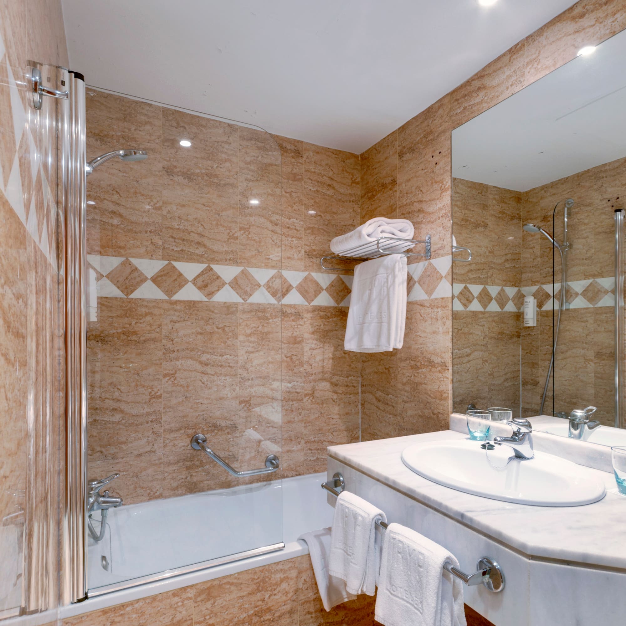 a bathroom with a shower and sink