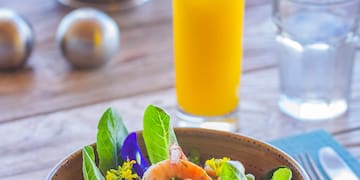 a bowl of salad with shrimp and vegetables