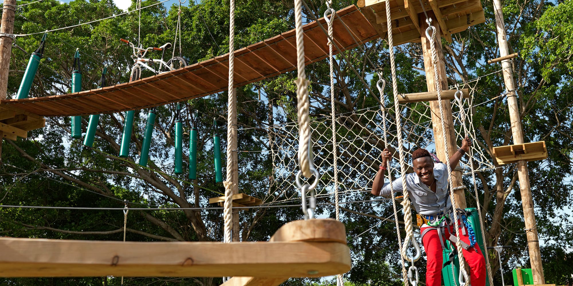 a man on a rope bridge