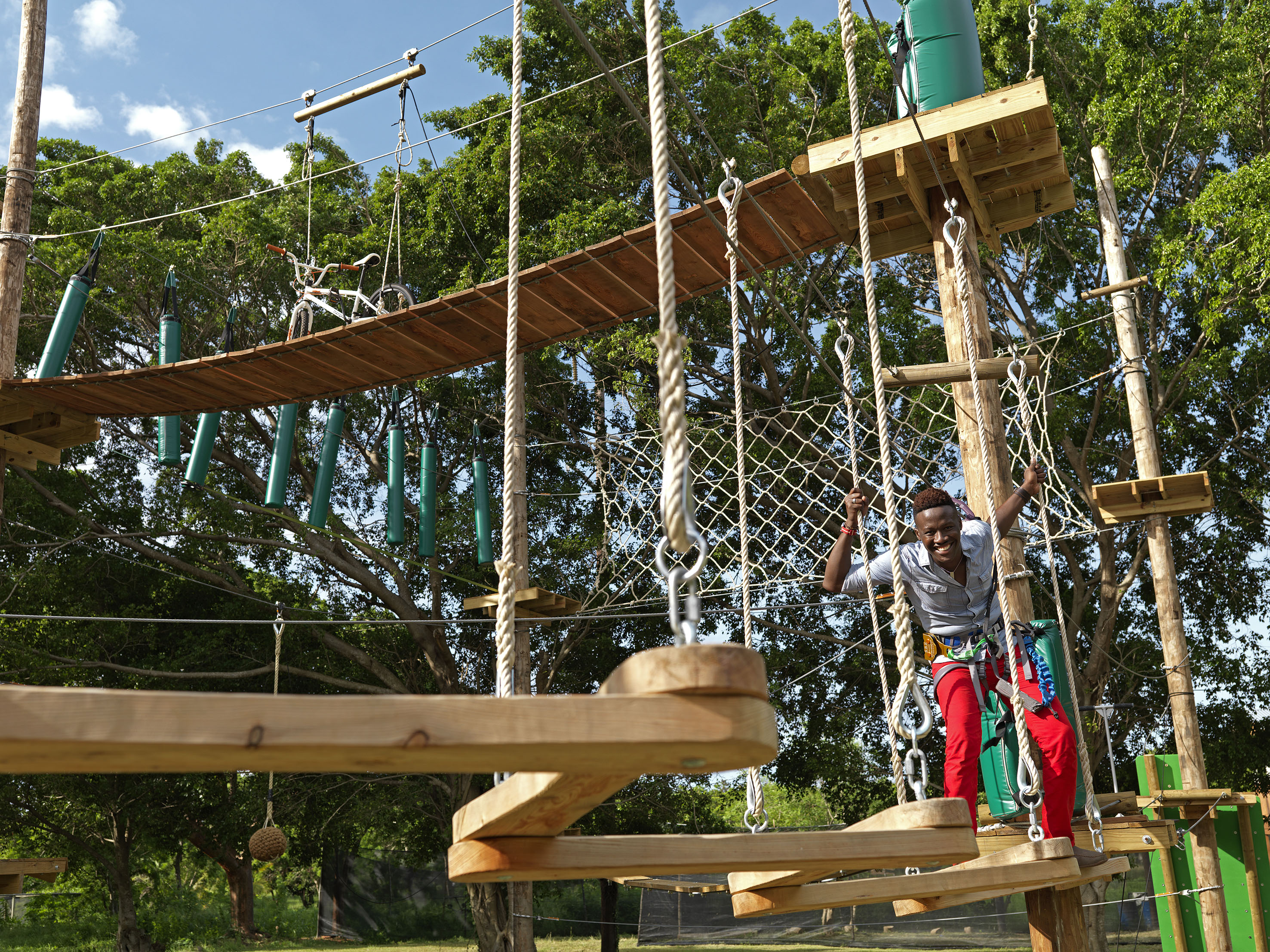 a man on a rope bridge