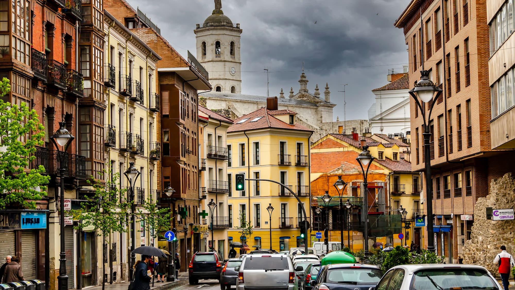 a street with cars and buildings on the side