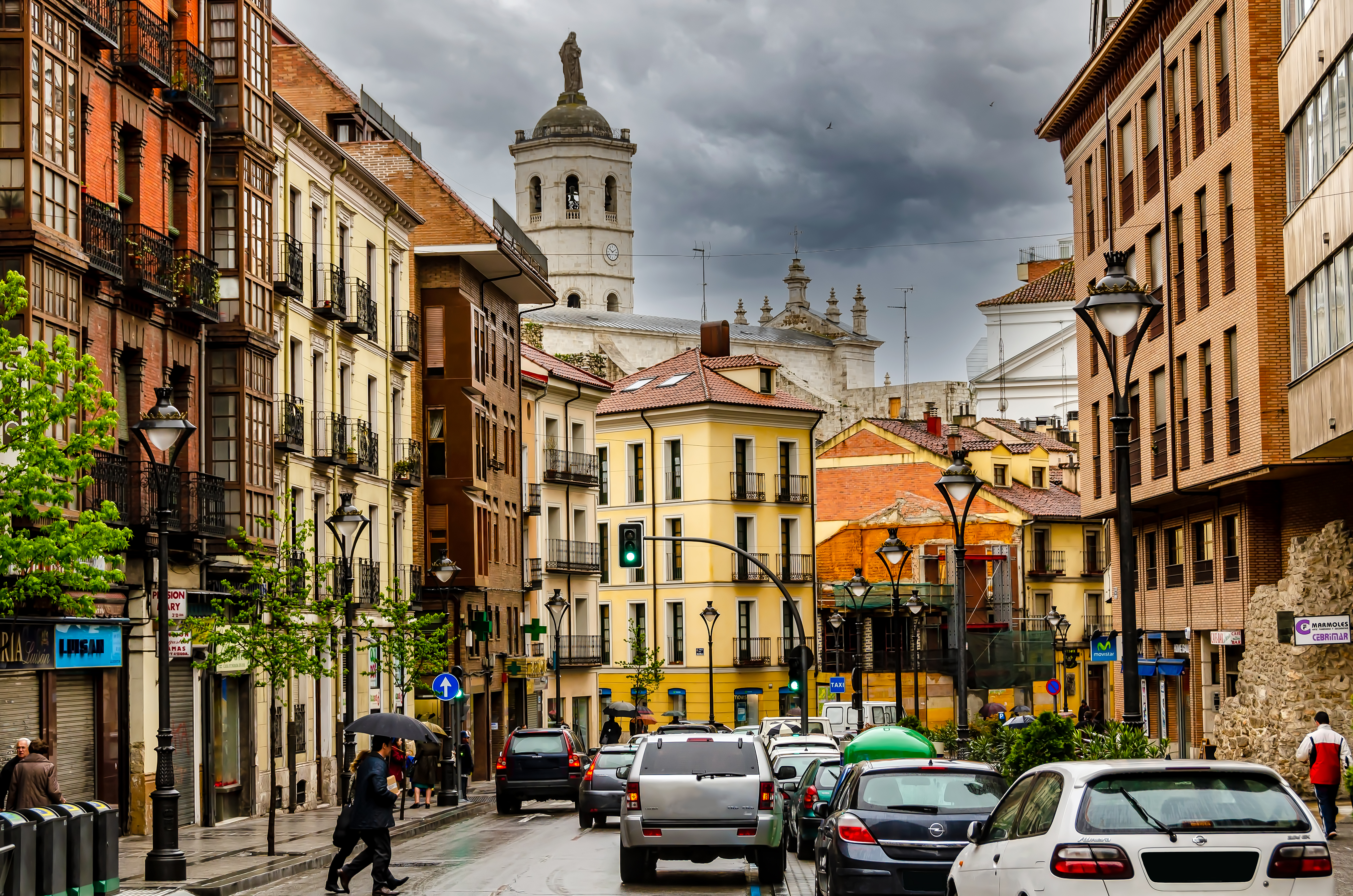 a street with cars and buildings on the side