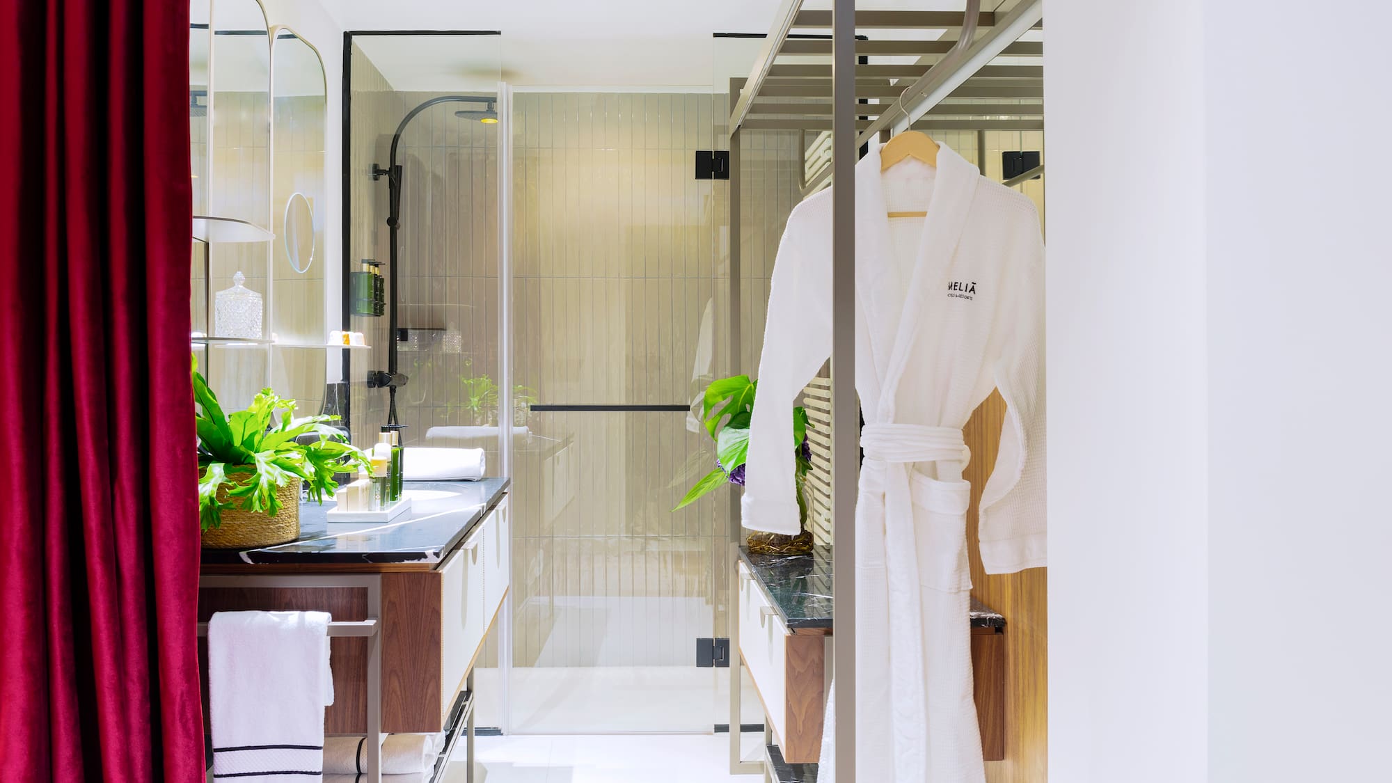 a bathroom with a shower and a bathrobe