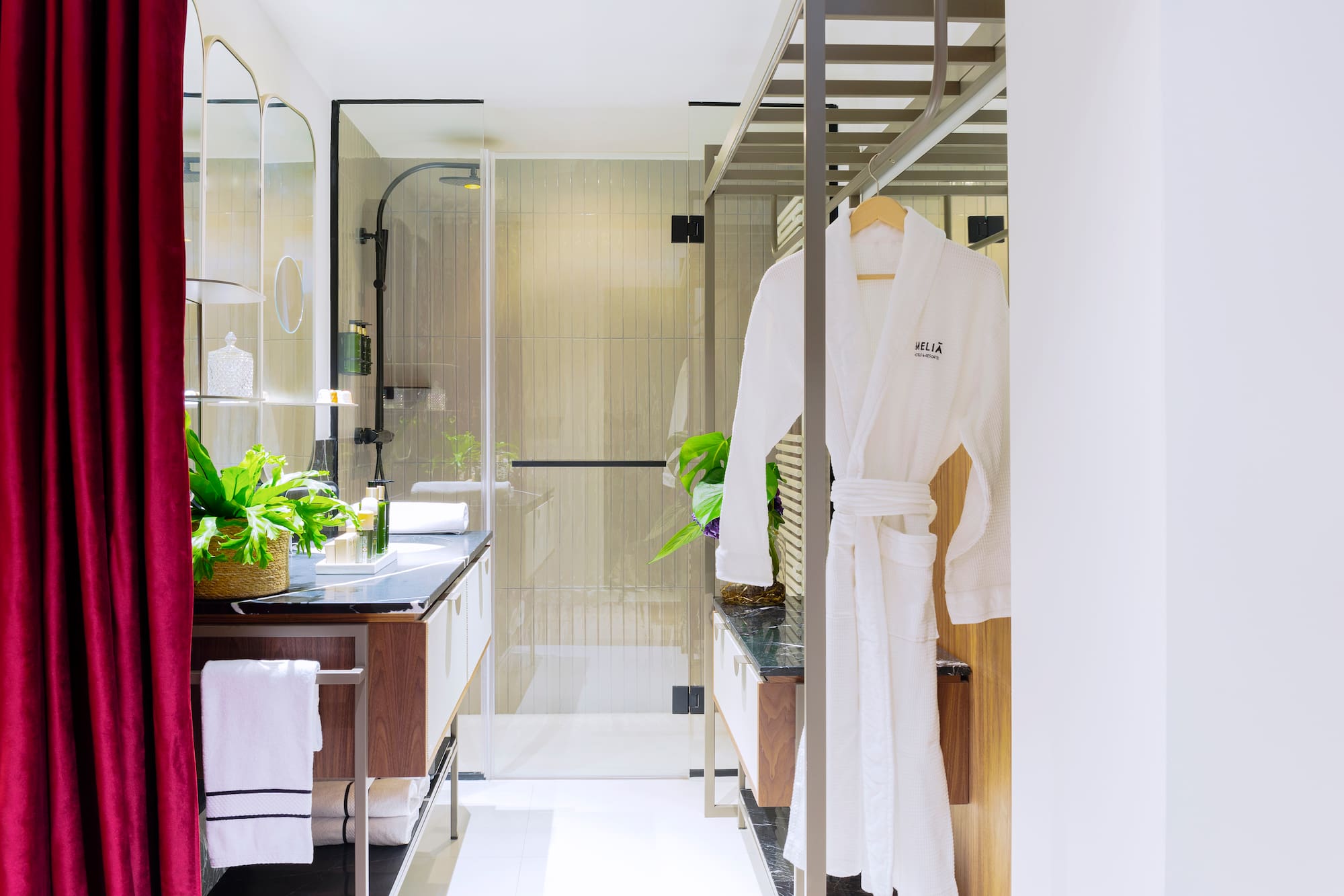 a bathroom with a shower and a bathrobe