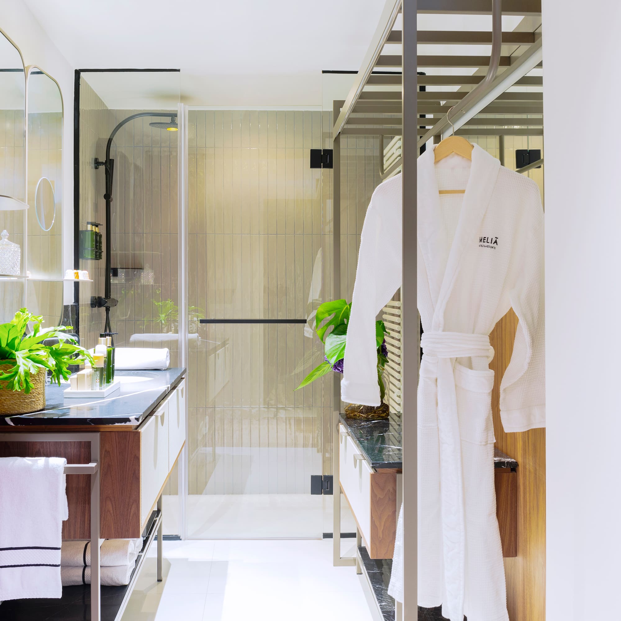 a bathroom with a shower and a bathrobe