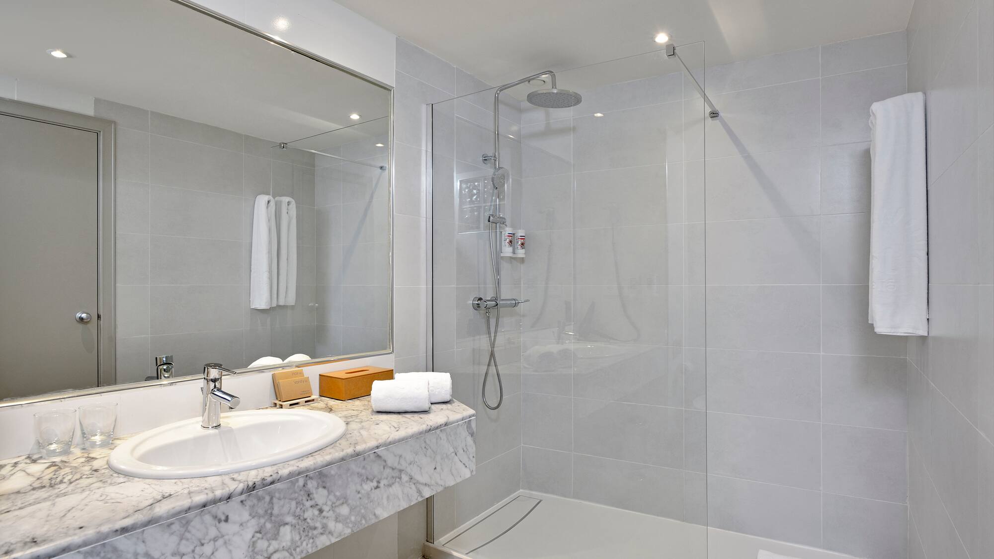 a bathroom with a shower and sink