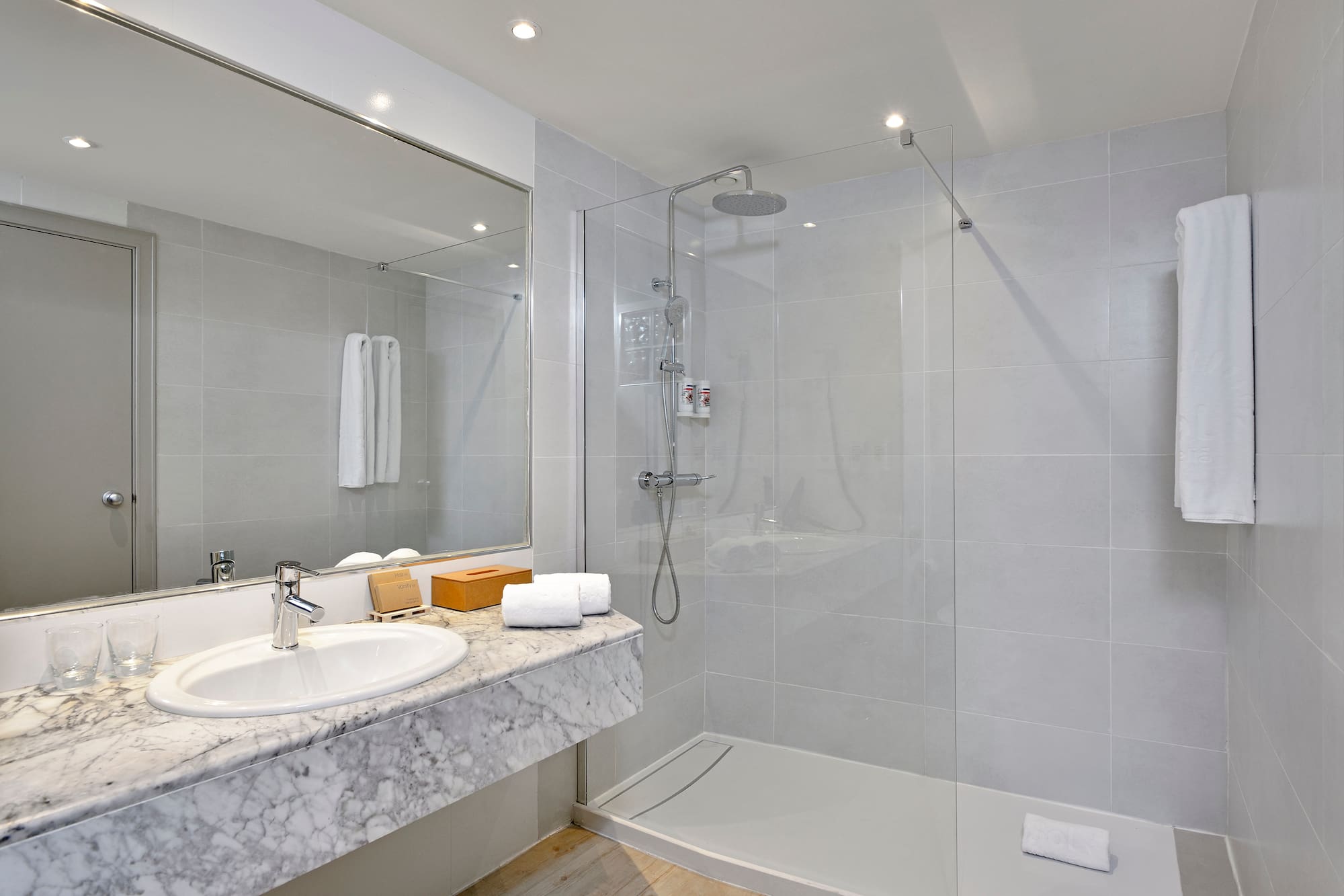 a bathroom with a shower and sink