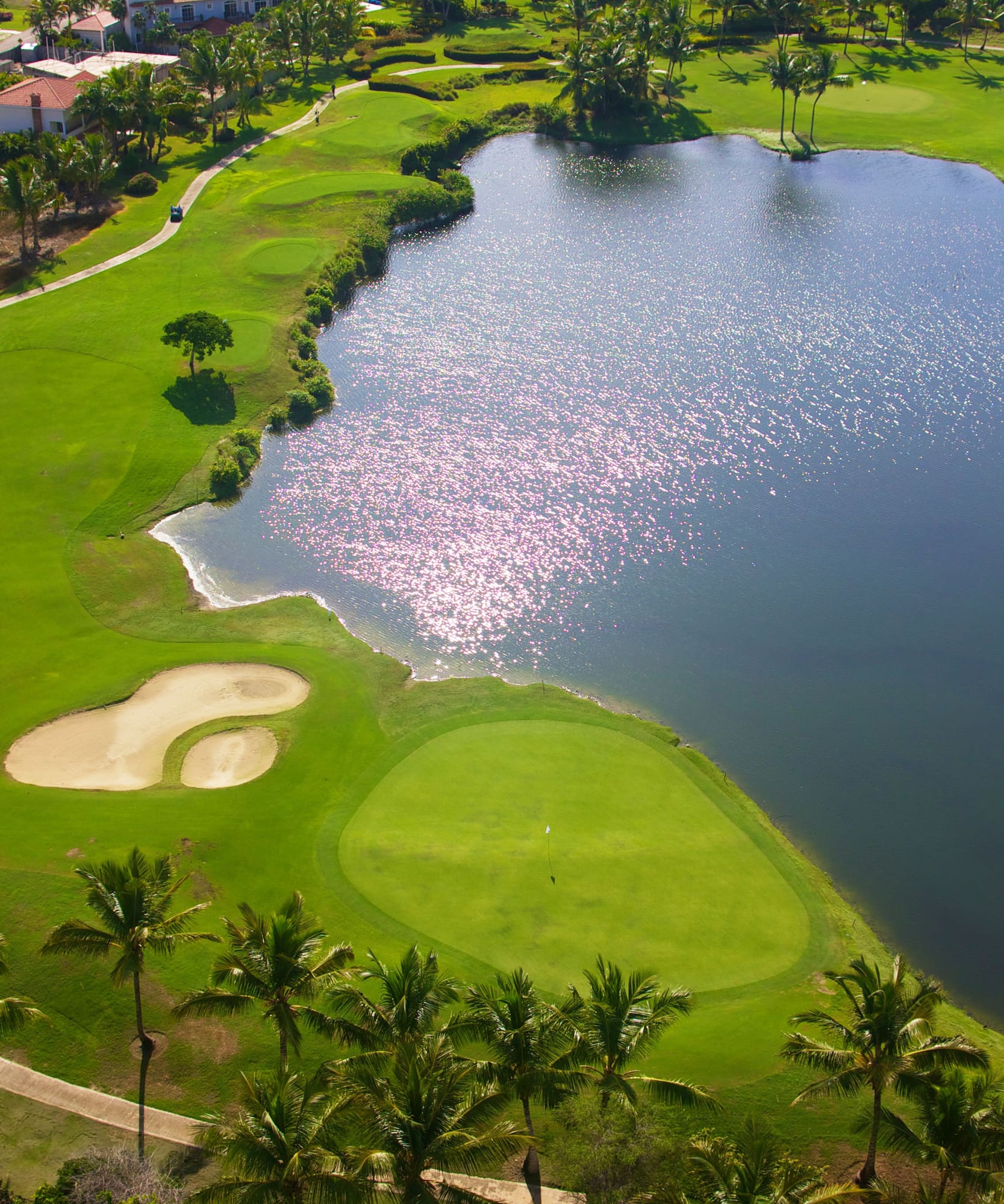 a golf course with a body of water
