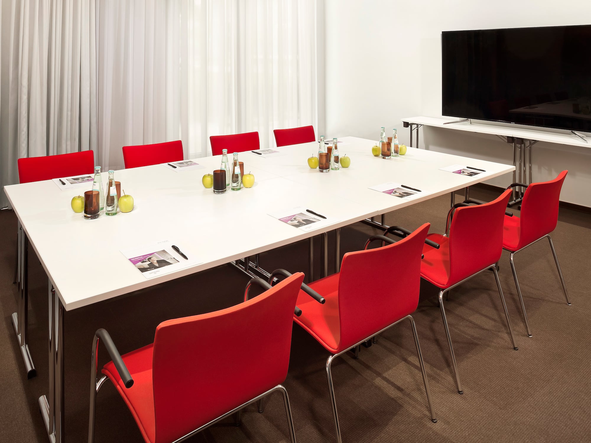 a room with a table and chairs