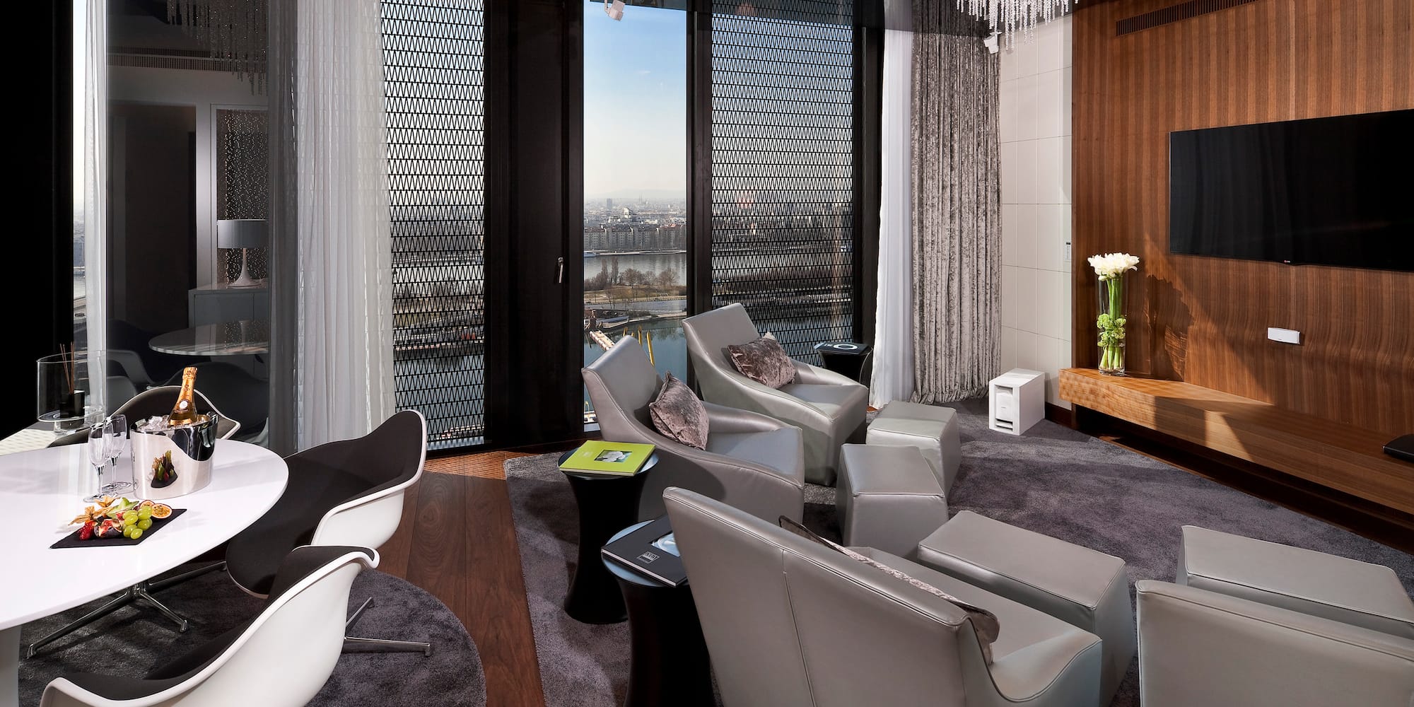 a room with a chandelier and chairs