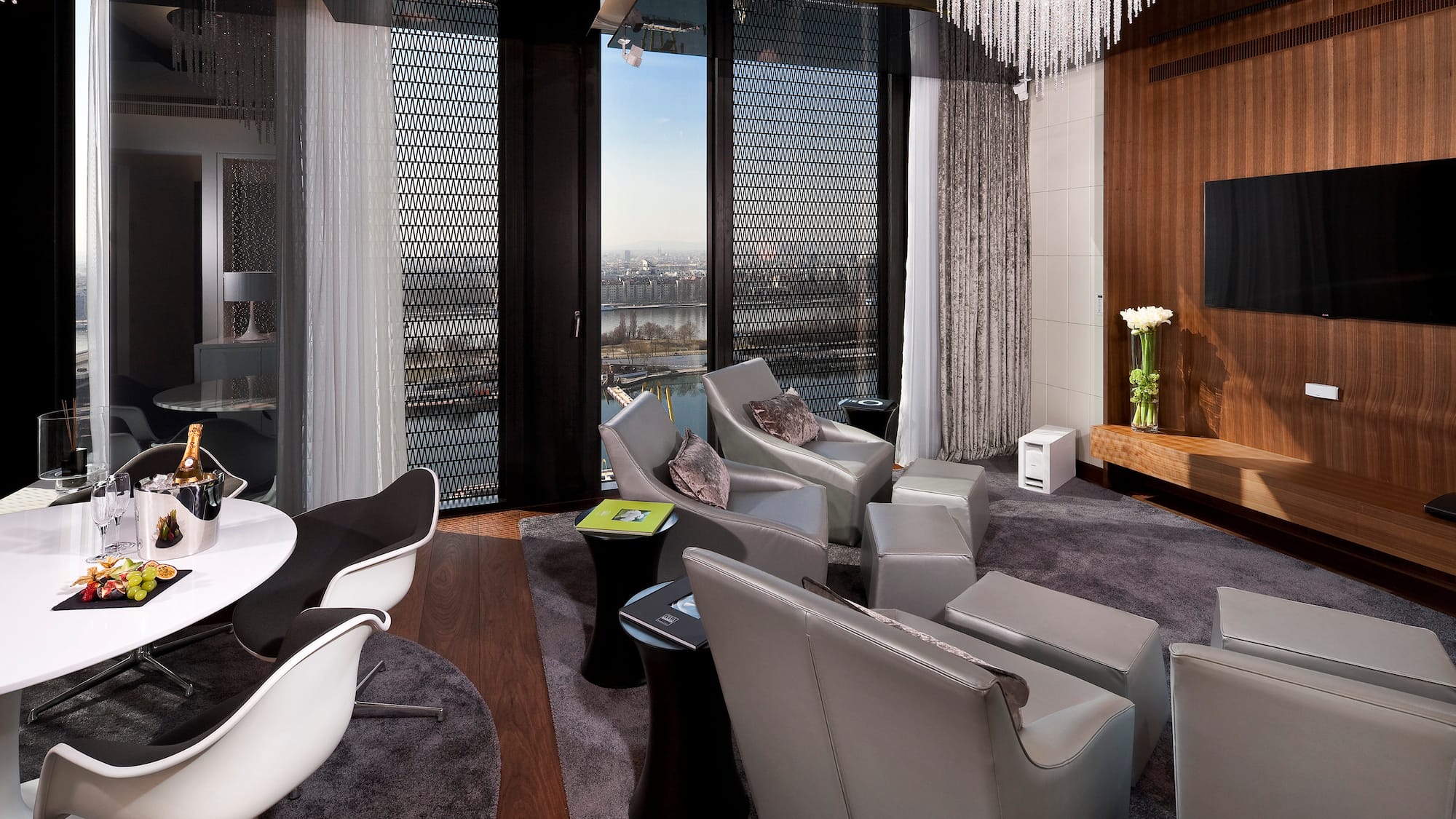 a room with a chandelier and chairs