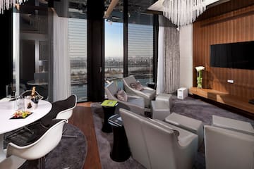 a room with a chandelier and chairs
