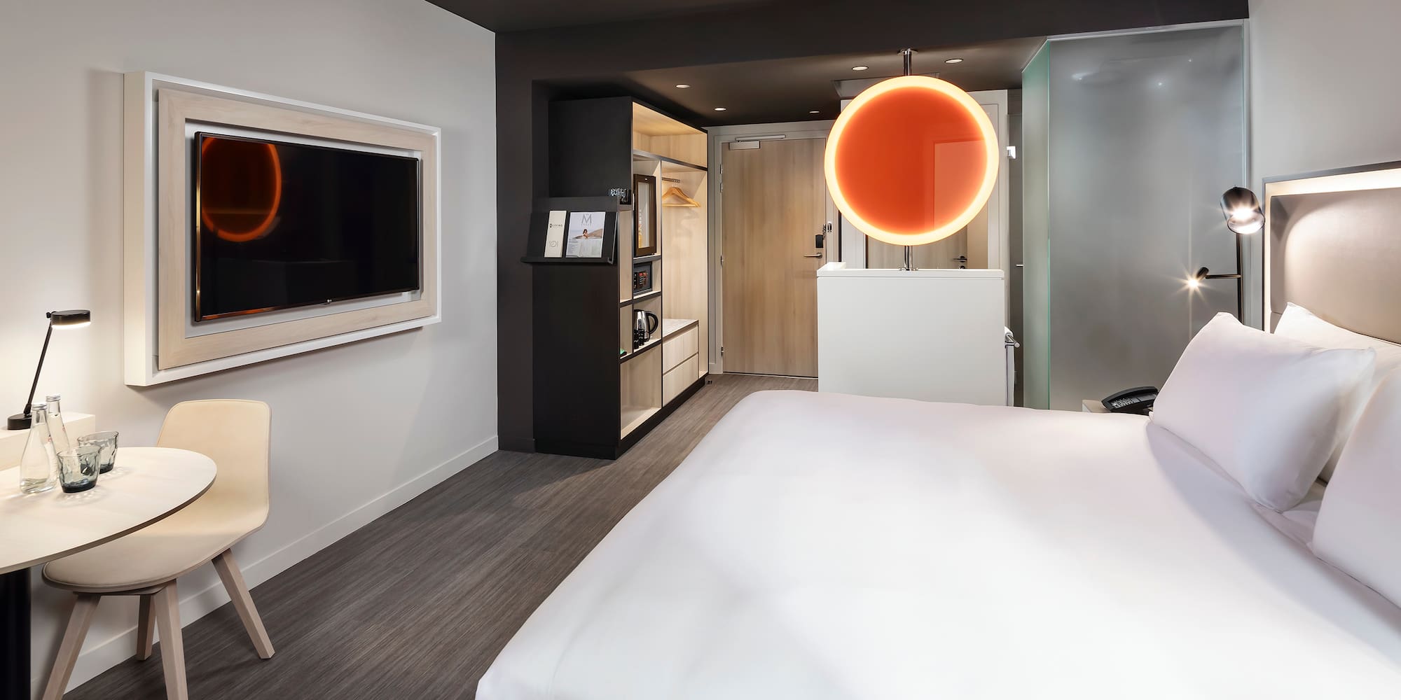 a room with a bed and a tv