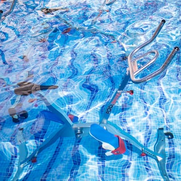a swimming pool with a bike and ladders