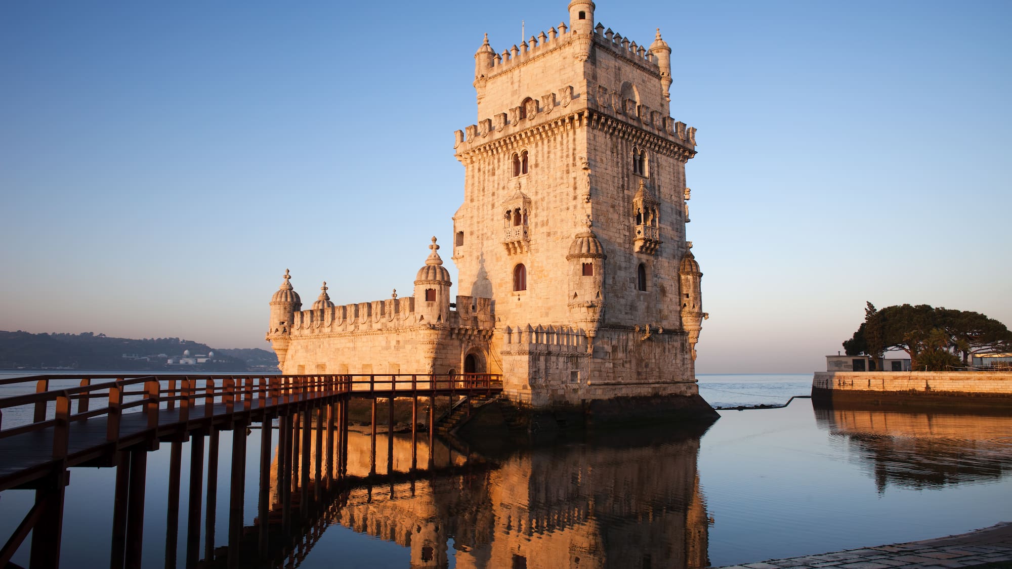a castle on the water with Belém Tower in the background