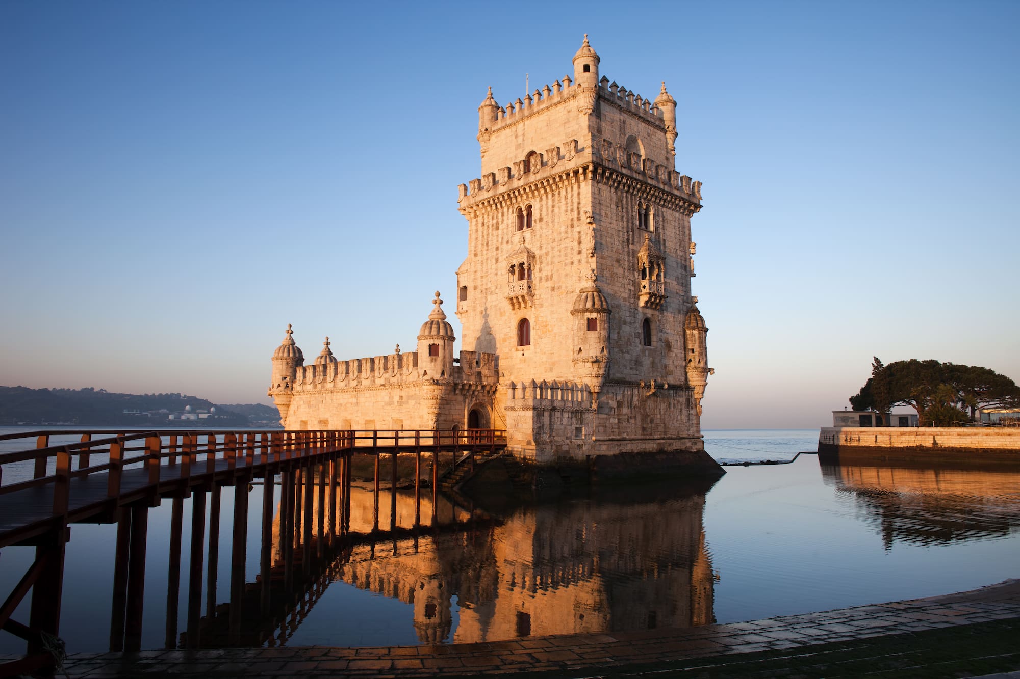 a castle on the water with Belém Tower in the background