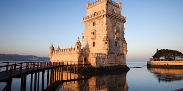 a castle on the water with Belém Tower in the background