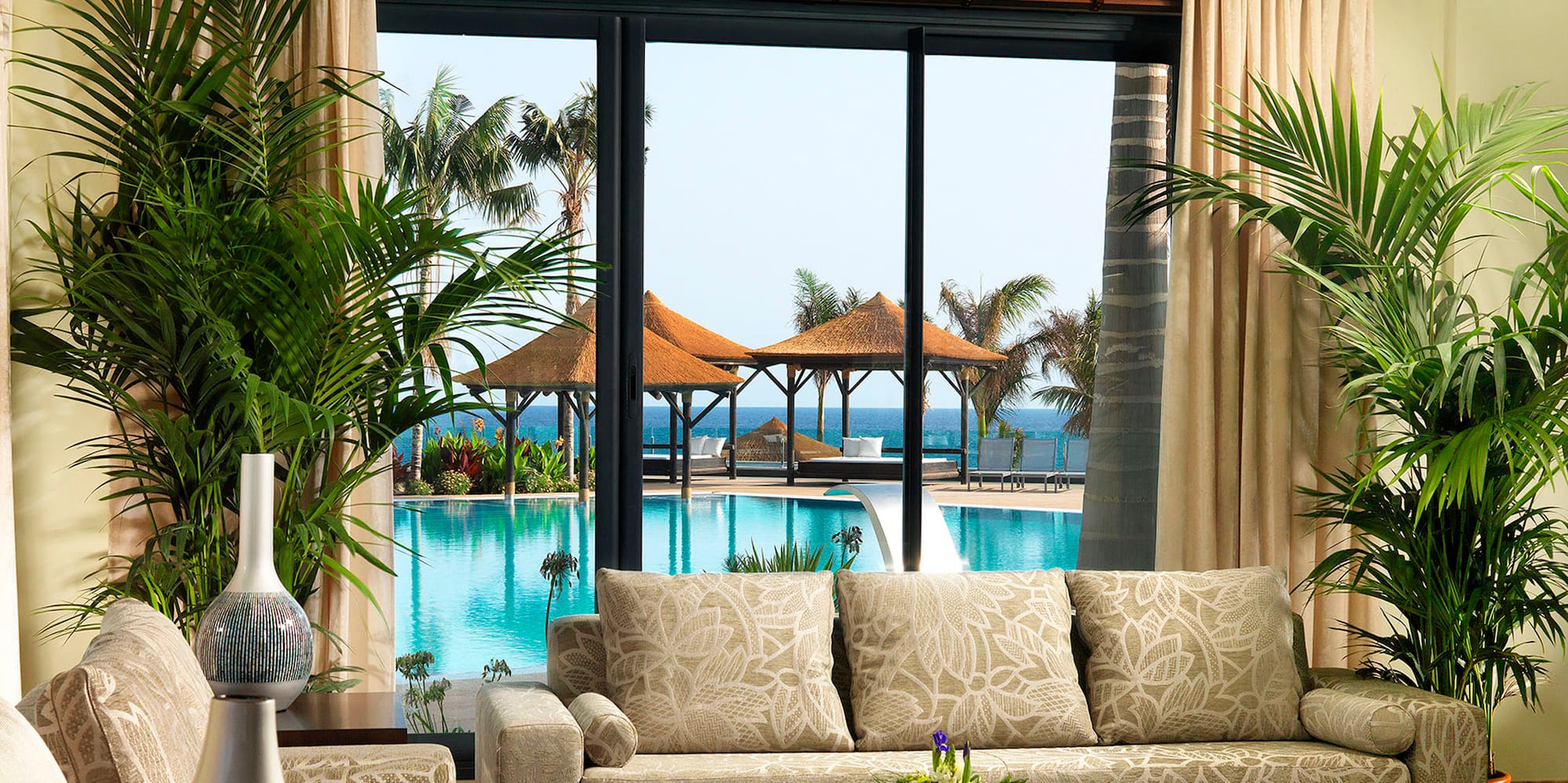 a room with a pool and a couch