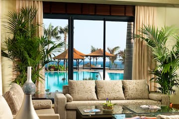 a room with a pool and a couch