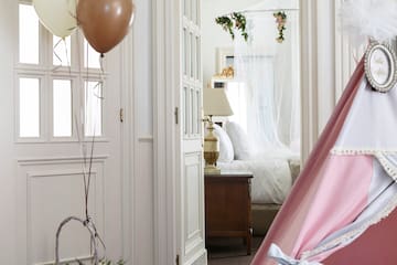 a room with a tent and balloons