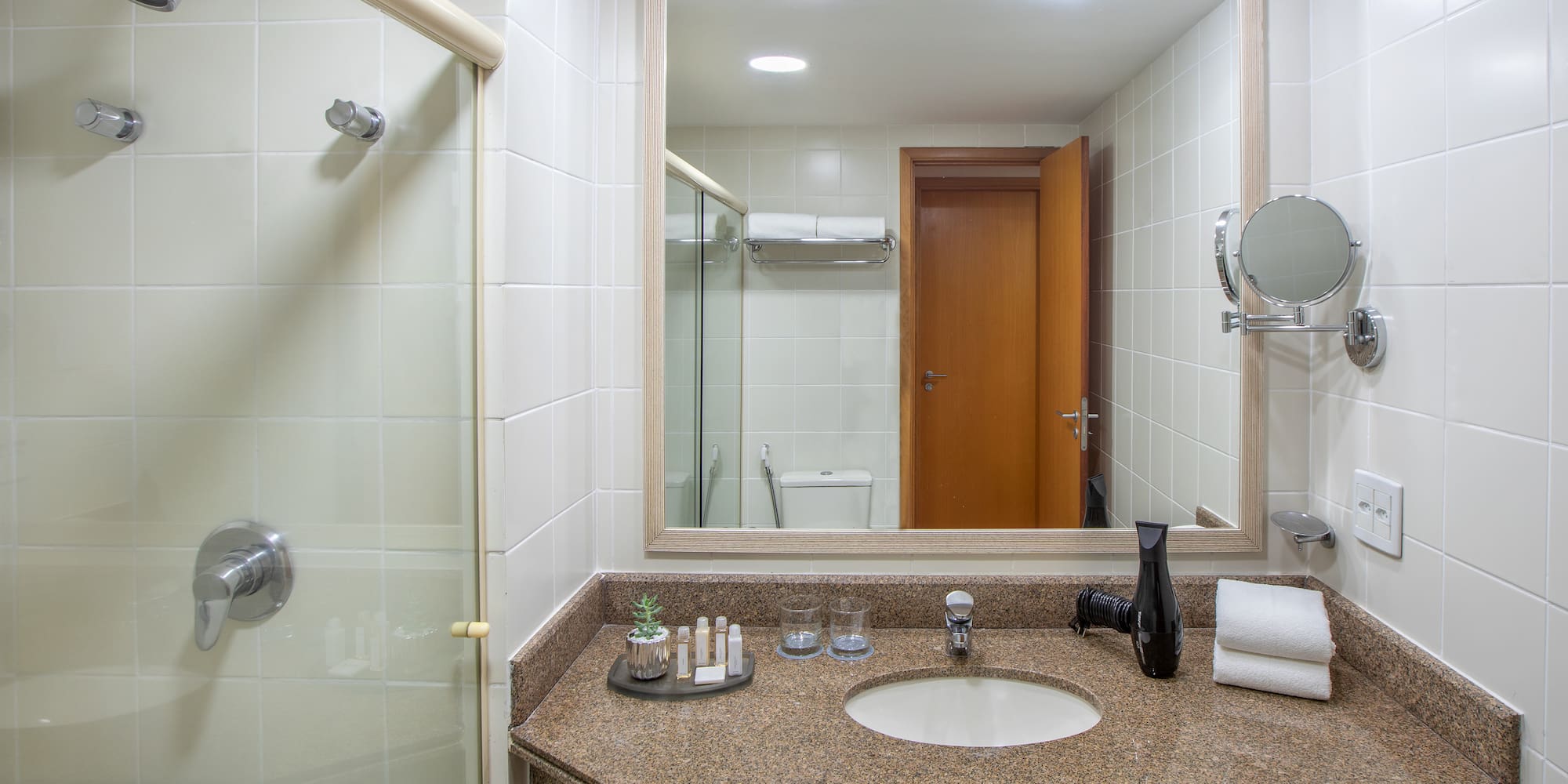 a bathroom with a mirror and sink