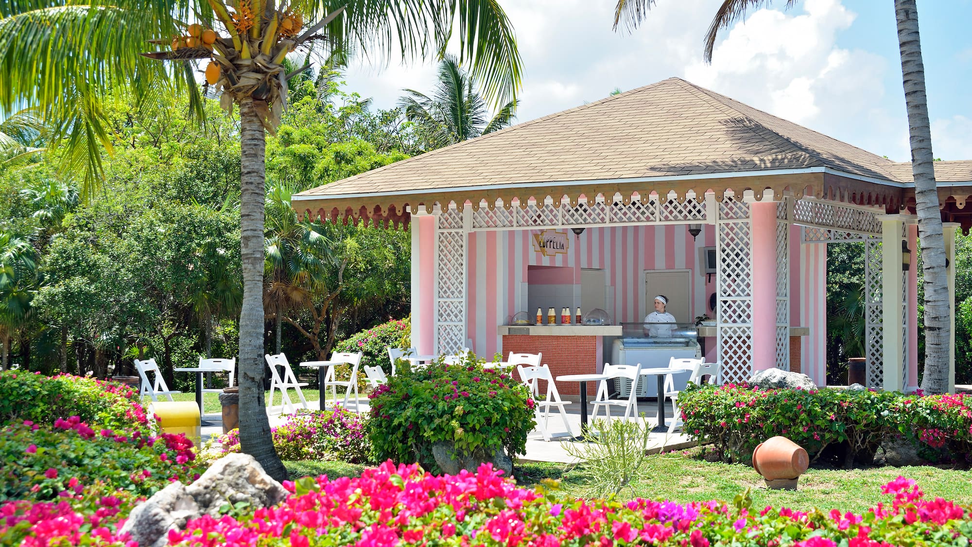a pink and white striped building with a pink and white striped structure