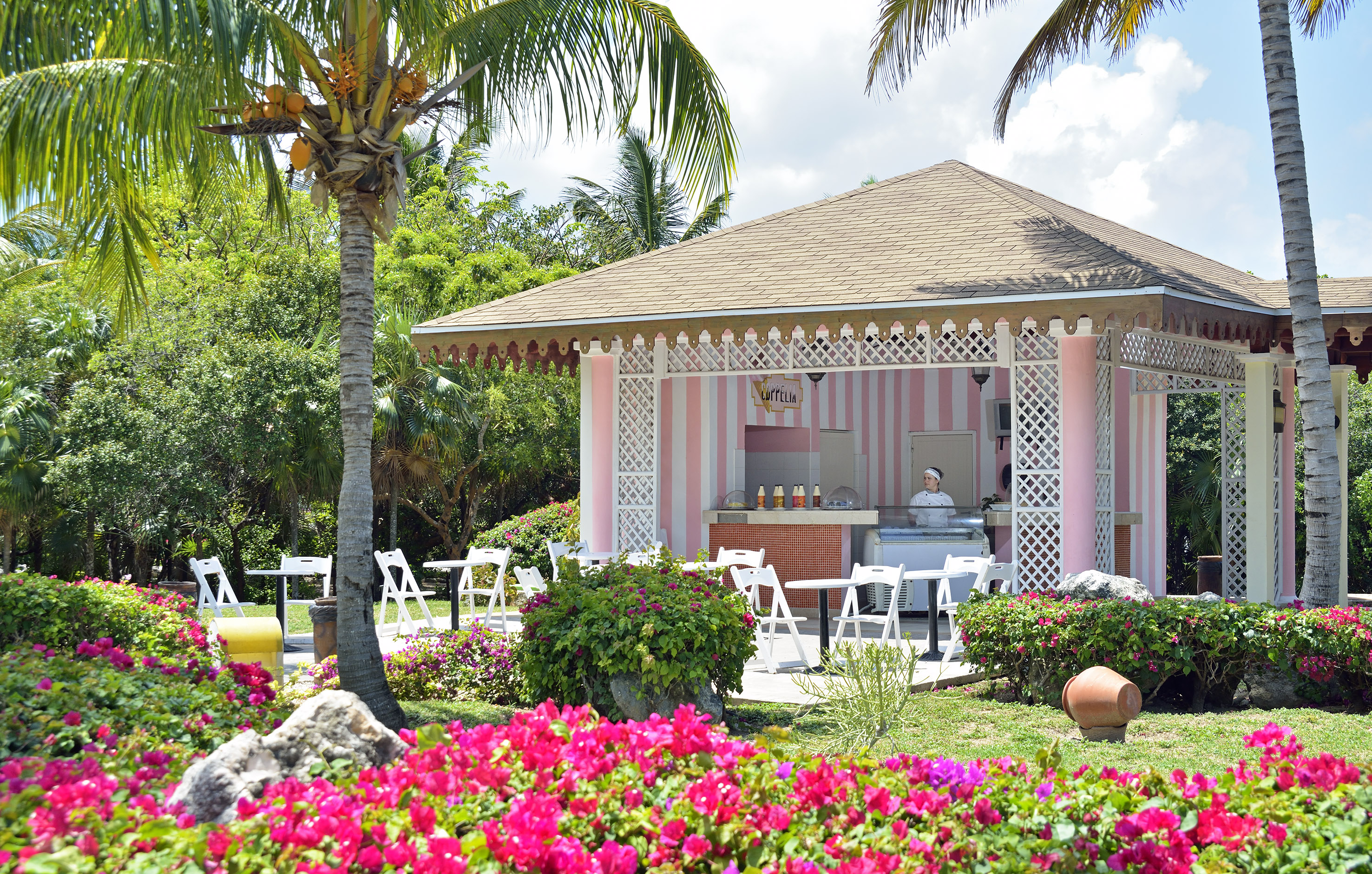 a pink and white striped building with a pink and white striped structure
