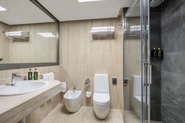 a bathroom with a shower and toilet