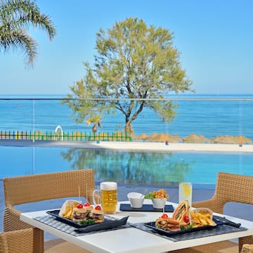 a table with food on it by a pool