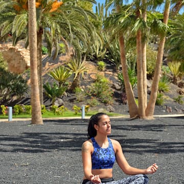 a woman sitting in a yoga pose