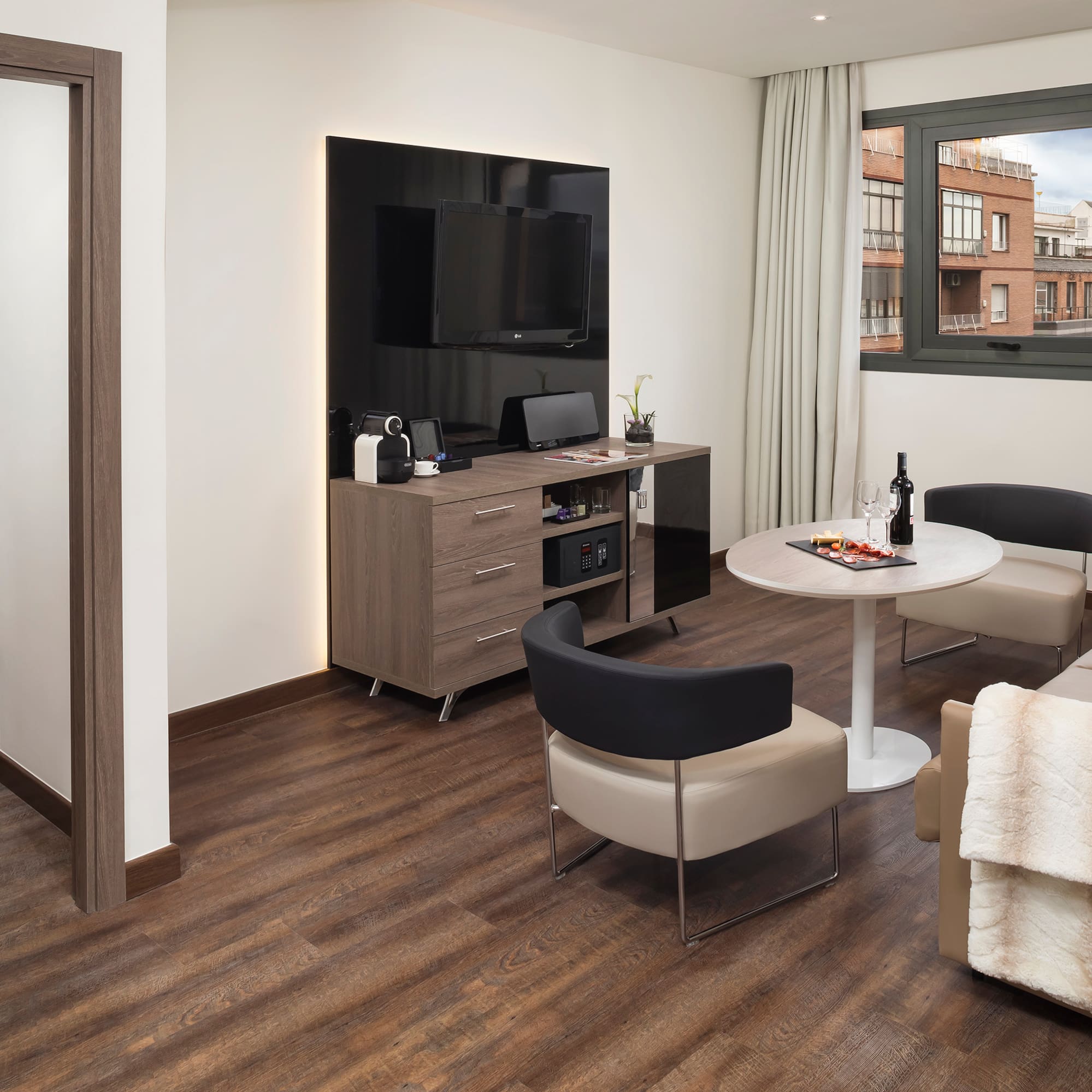 a room with a tv and a table