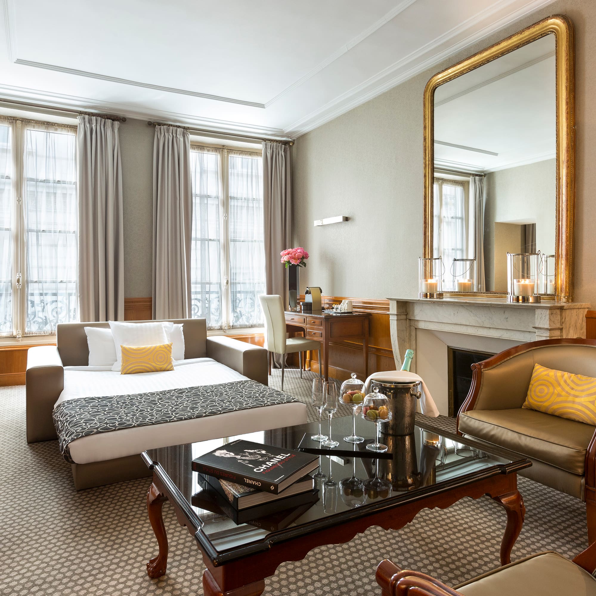 a room with a couch and a fireplace