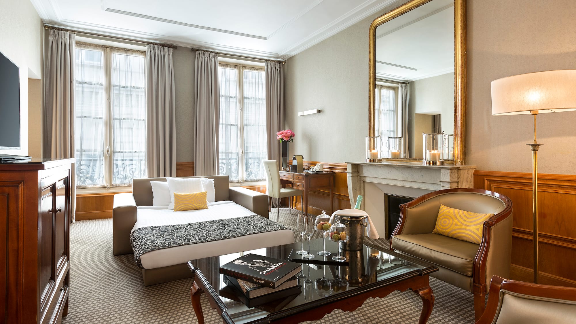 a room with a couch and a fireplace