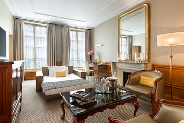 a room with a couch and a fireplace