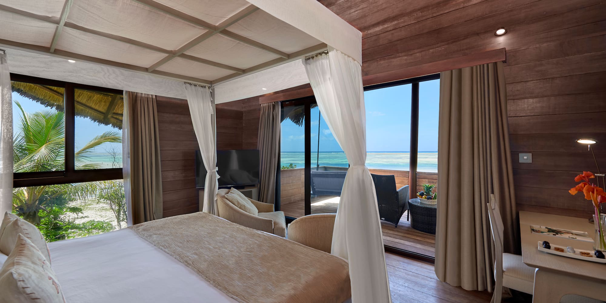 a room with a bed and a glass door