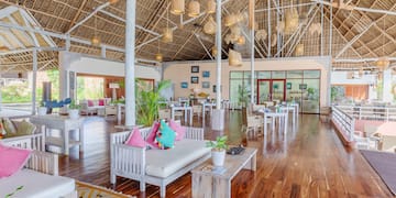 a room with a large ceiling and a large white couch