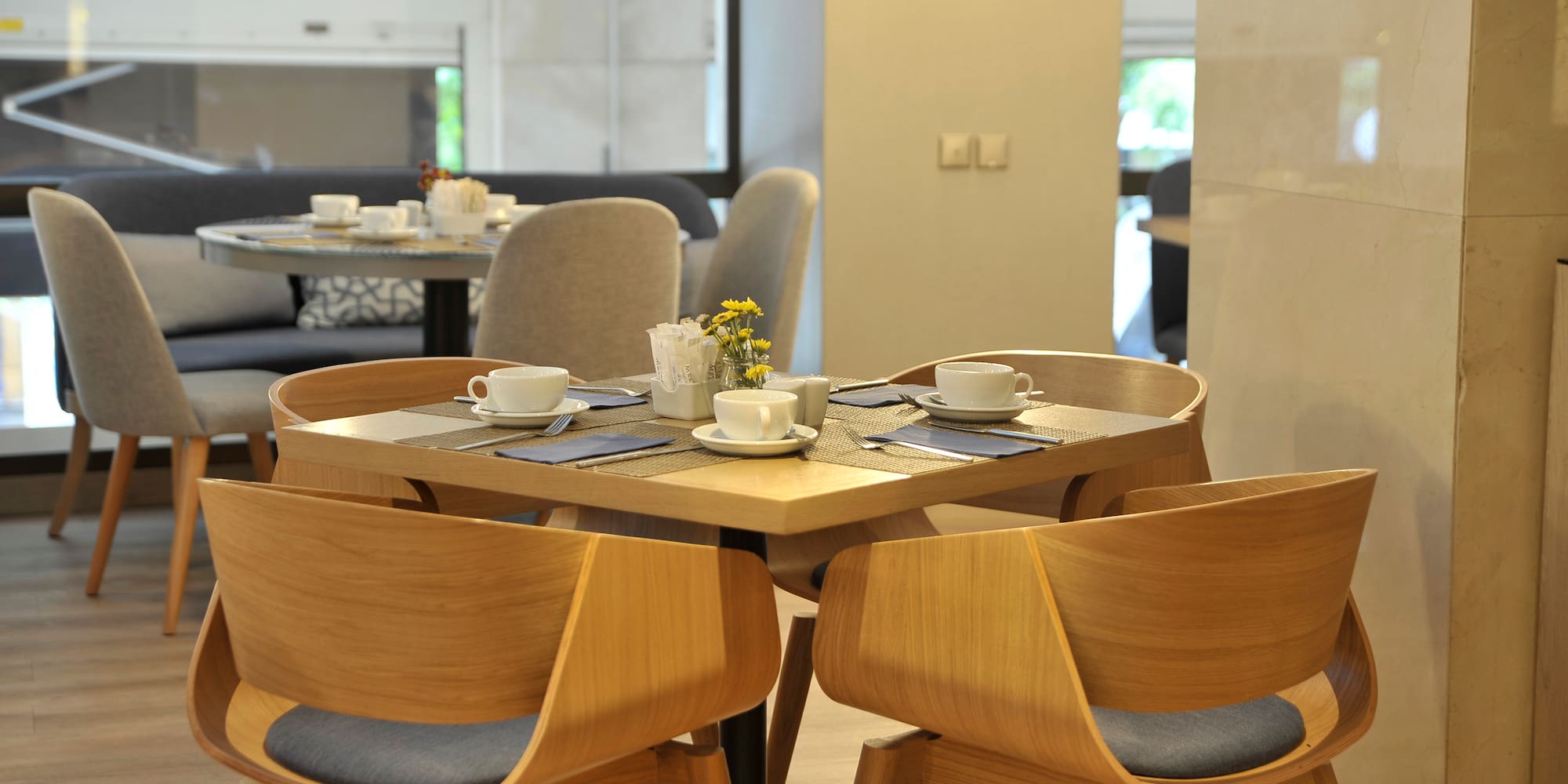 a table with chairs and cups