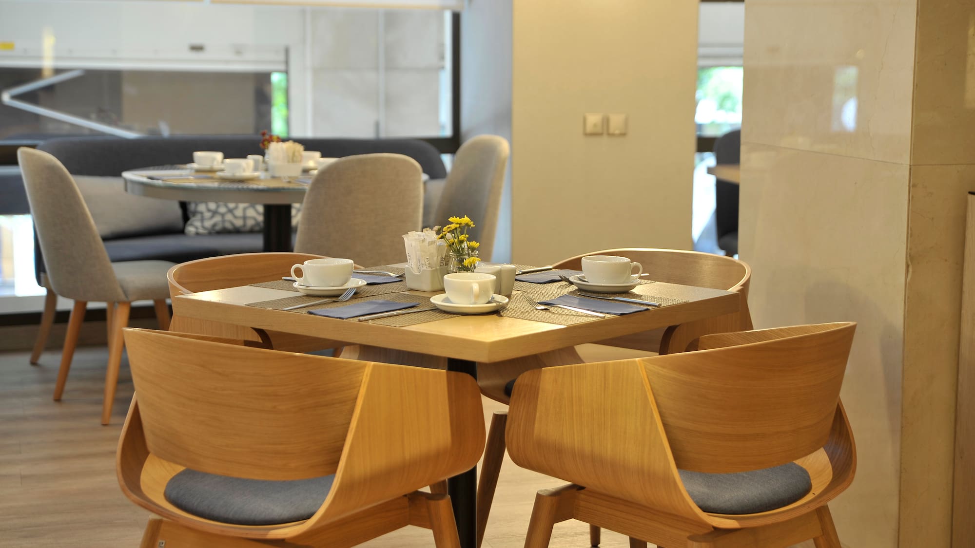 a table with chairs and cups