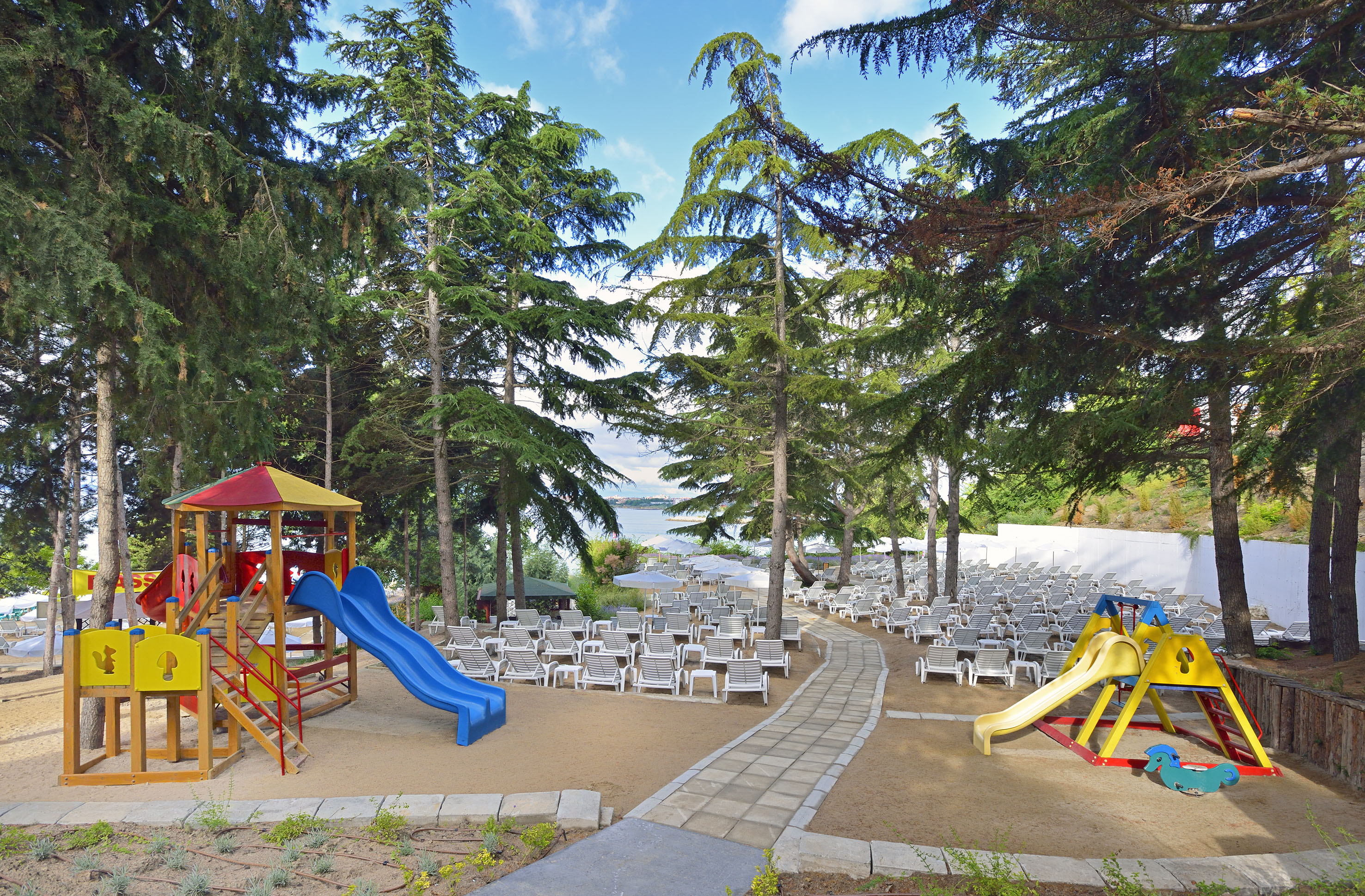 a playground with chairs and a beach chair