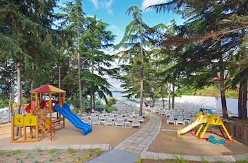 a playground with chairs and a beach chair