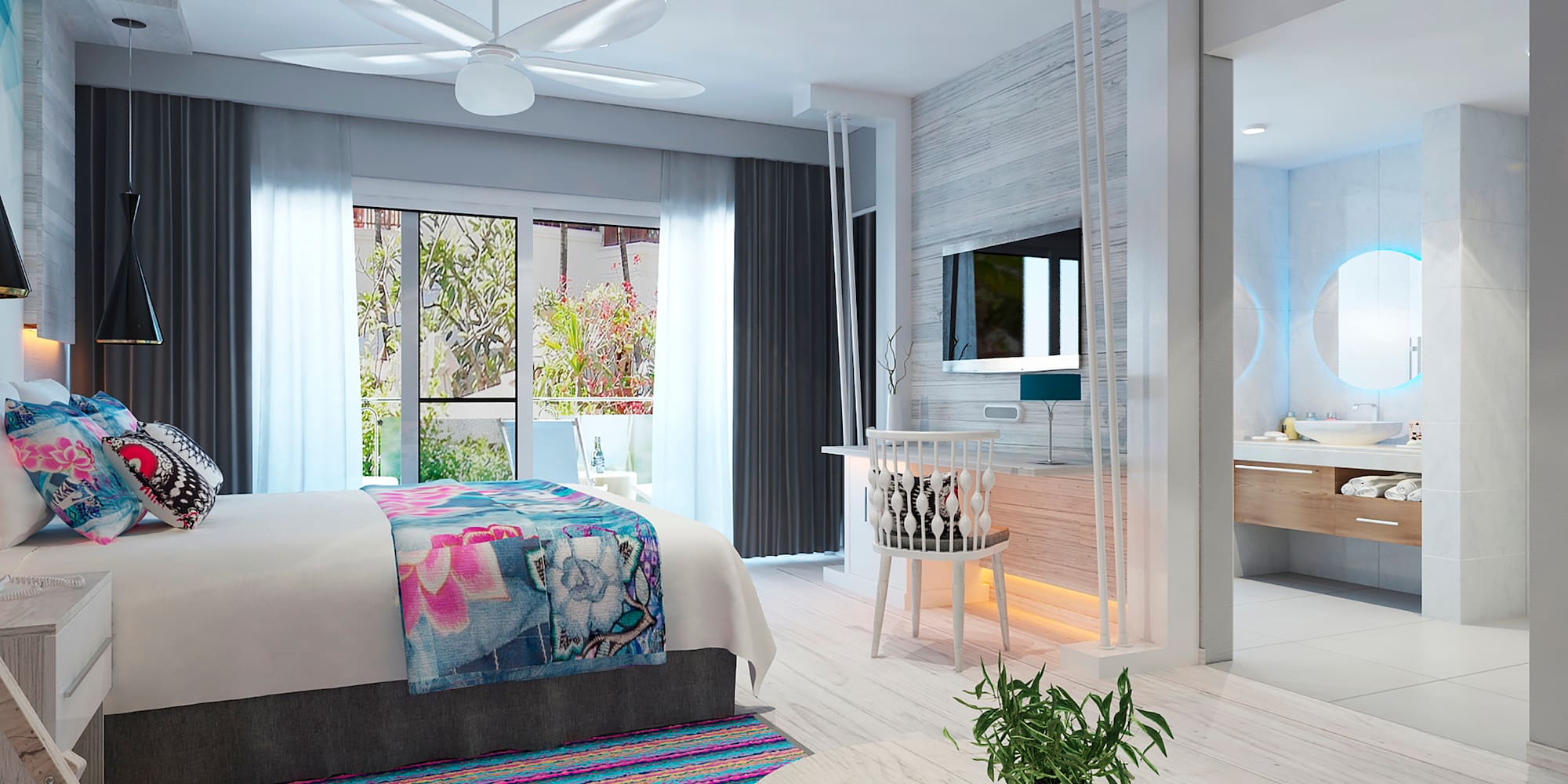 a bedroom with a bed and a sink and a mirror