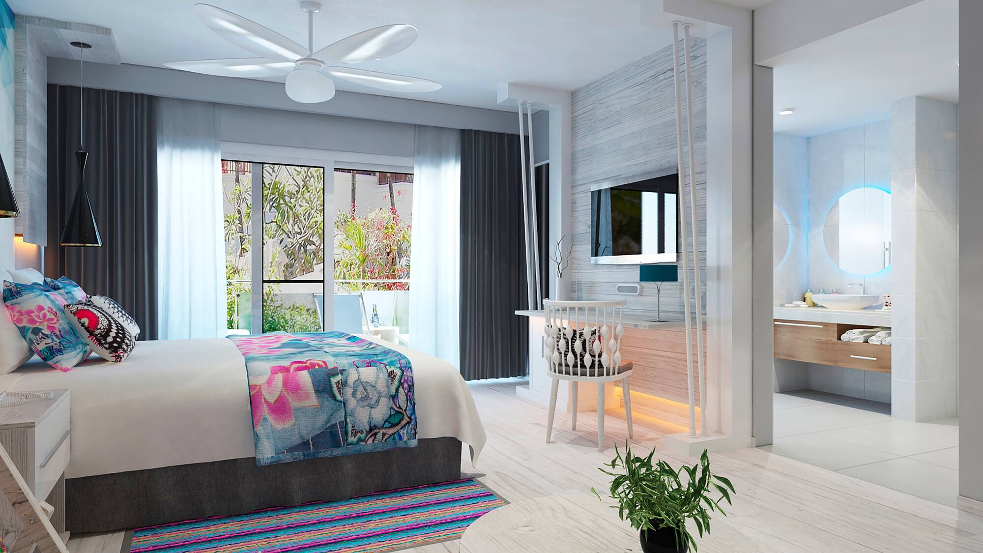 a bedroom with a bed and a sink and a mirror