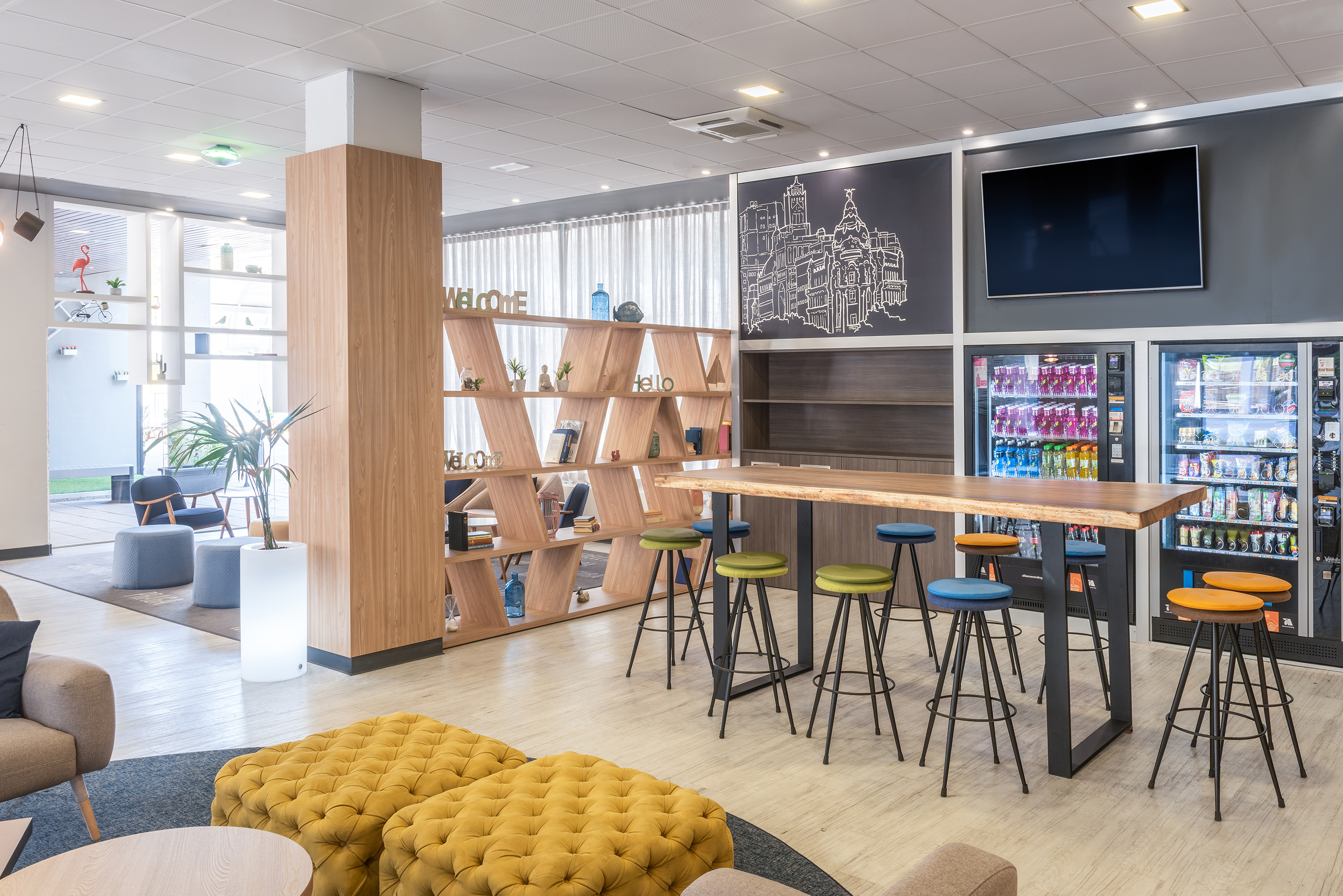 a room with a table and stools