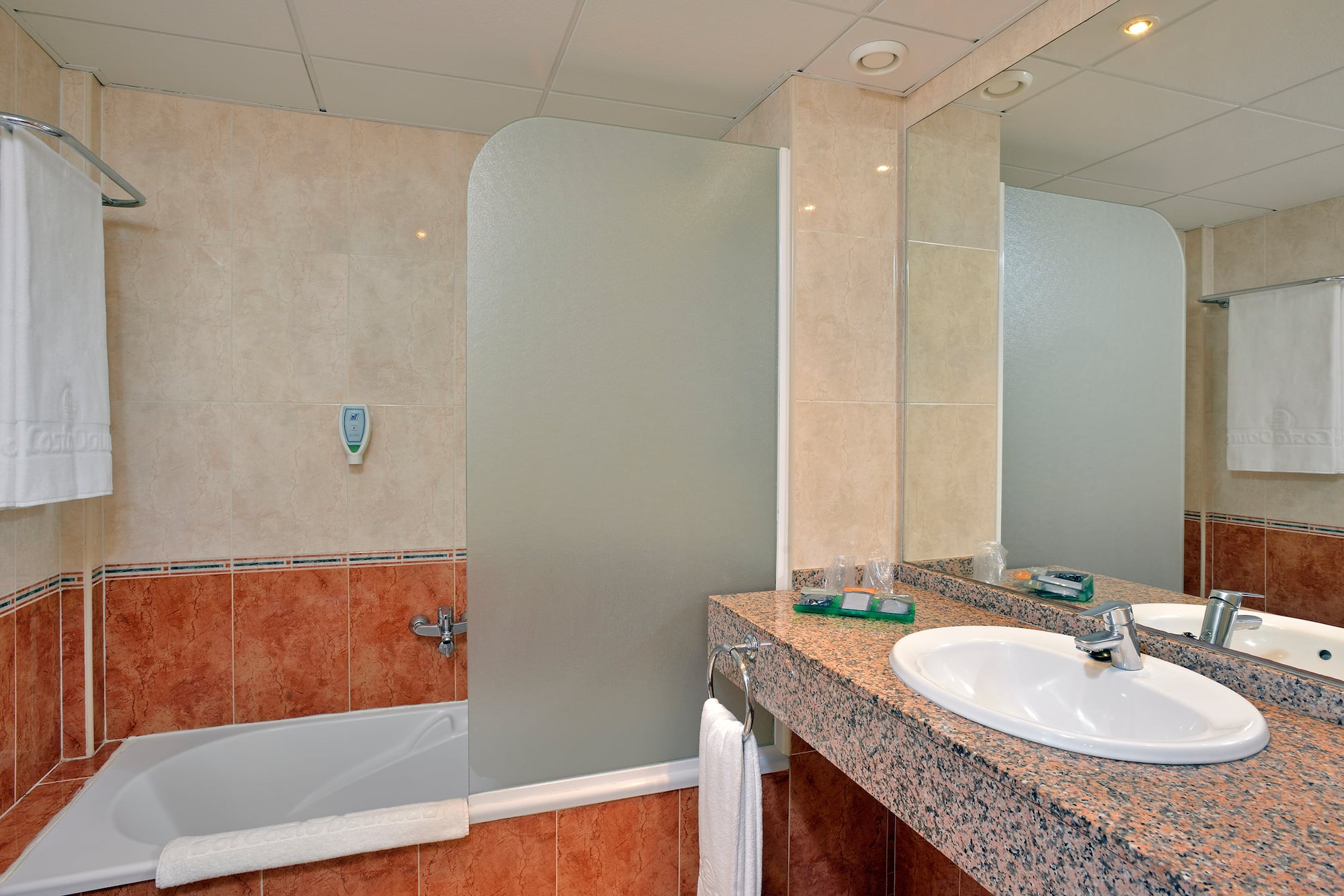 a bathroom with a shower and sink