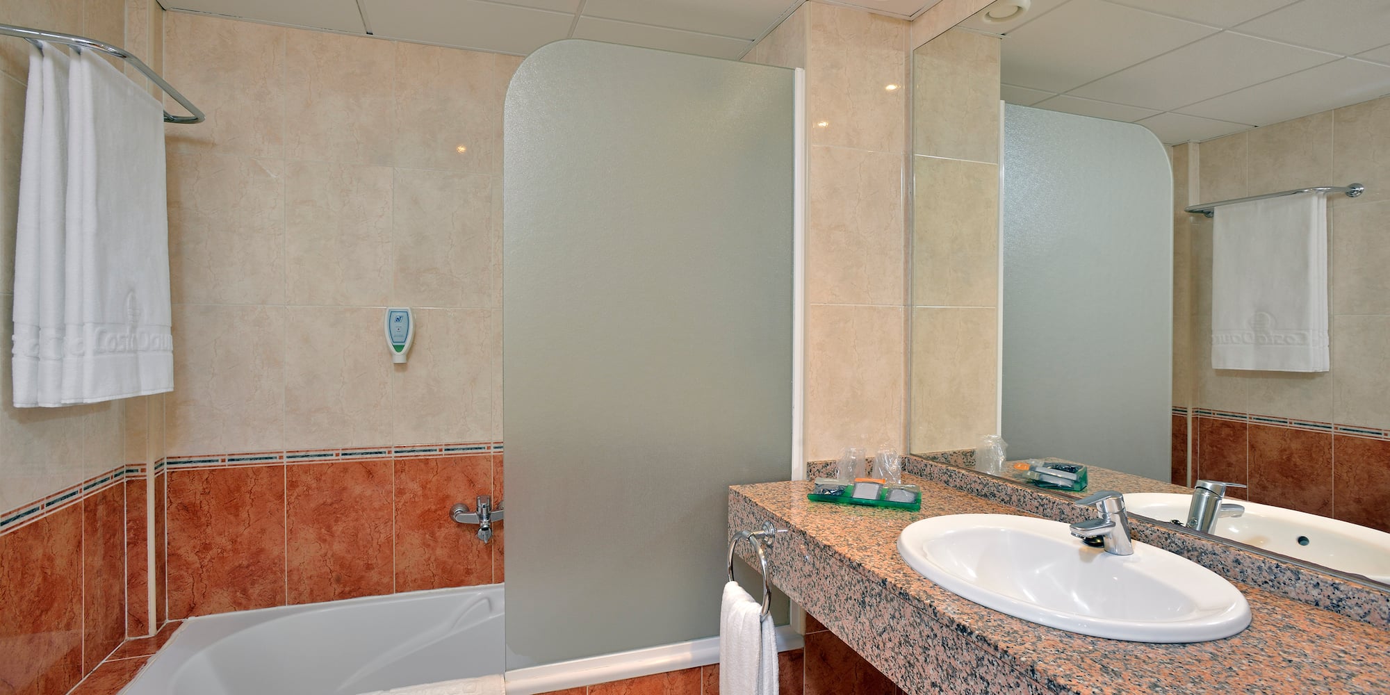 a bathroom with a shower and sink