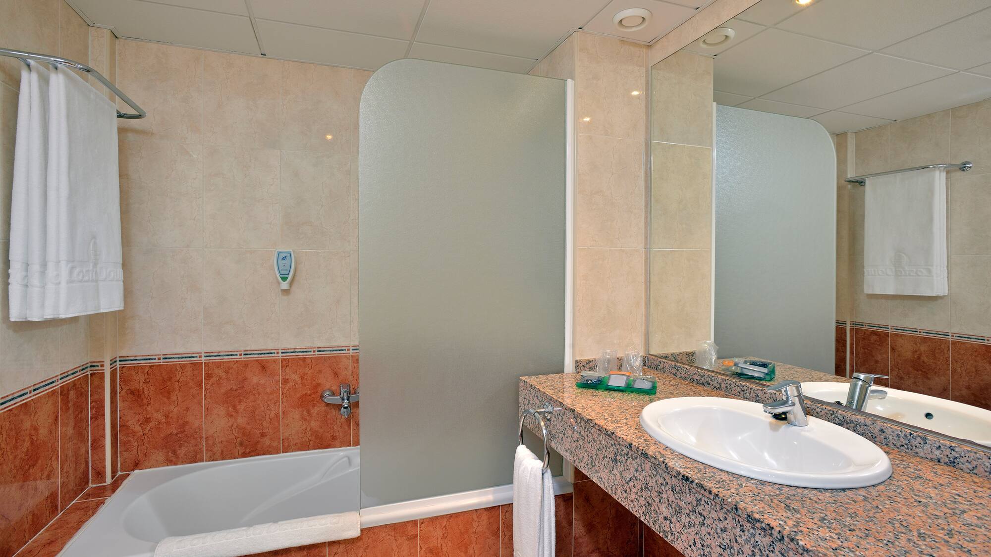 a bathroom with a shower and sink