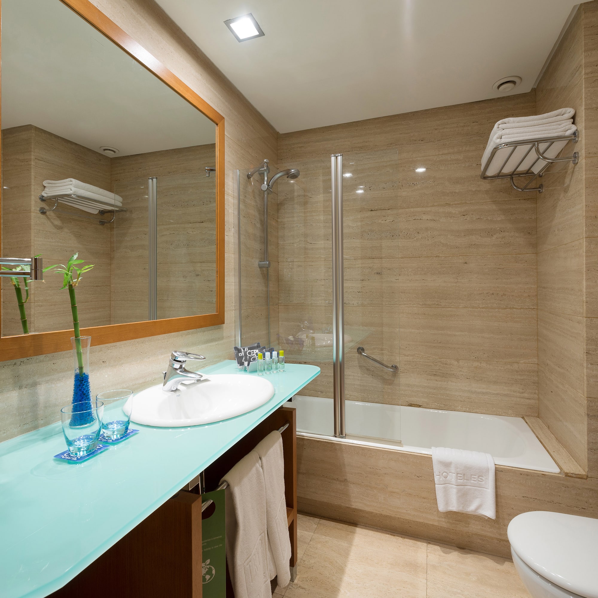 a bathroom with a mirror and a sink