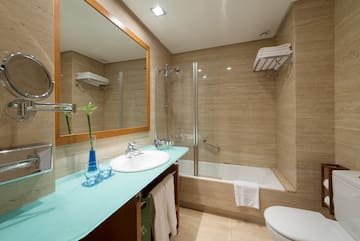 a bathroom with a mirror and a sink